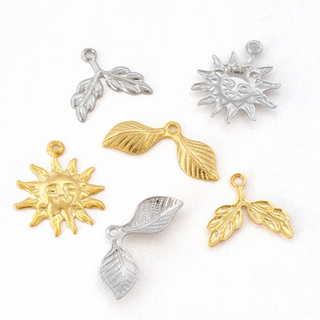 Brass charm, solar rhodium, color.