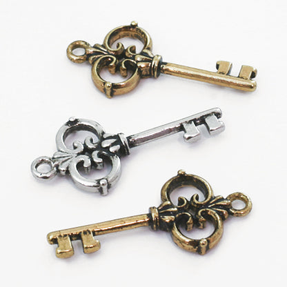 Antique charm key AG