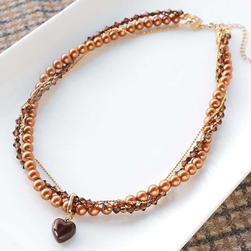 レシピNo.KR1318　チャームボンボンショコラハートとクリスタルのツイストネックレス