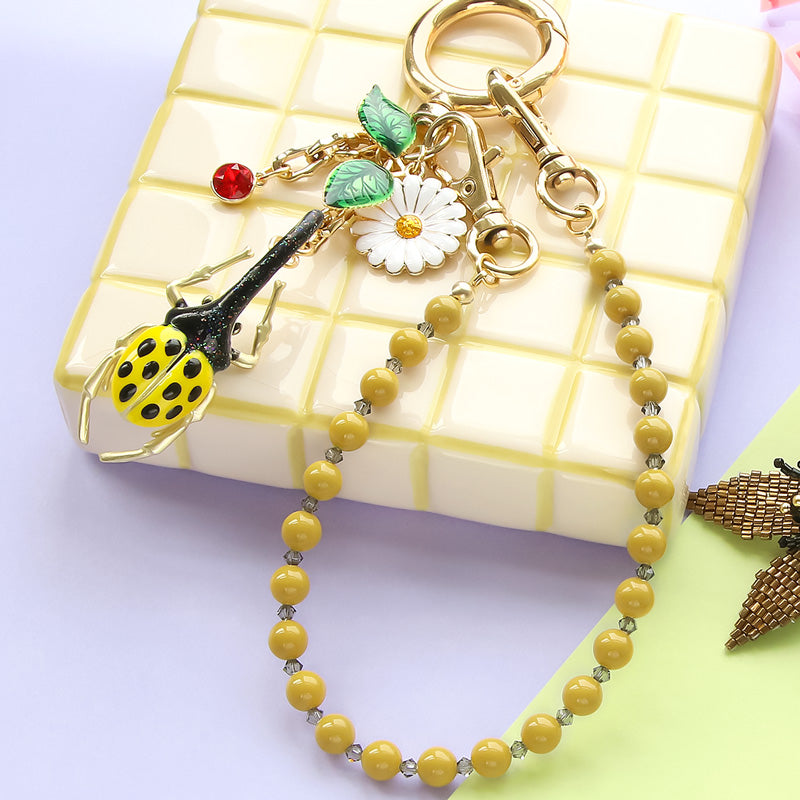 レシピNo.KR1361　スペインパーツのボタニカルバッグチャーム2種